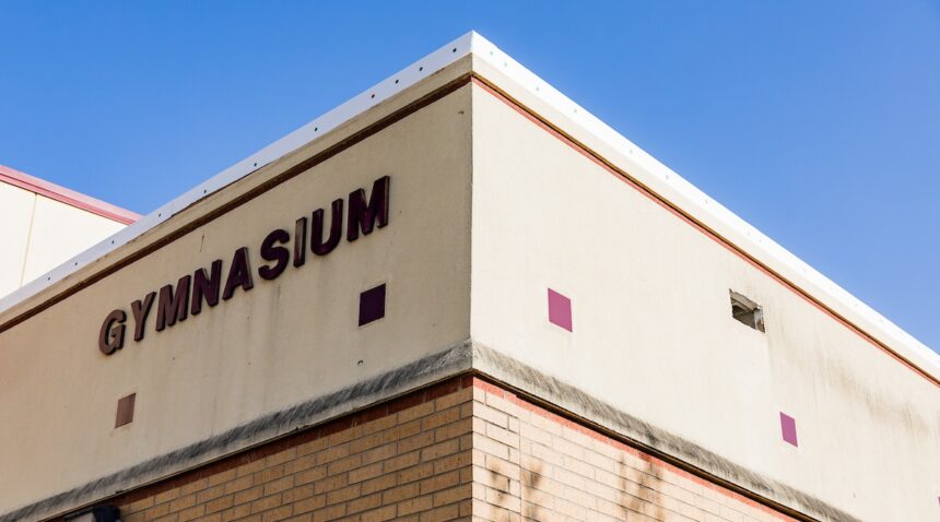 a photo of the corner of a building with letters spelling out 