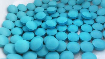 Pile of blue medication tablets