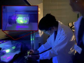 Students in Texas A&M's 2023 “Smash Chemistry” STEM camp use a luminescent polymer to study how forces are distributed in a mechanochemical reactor.