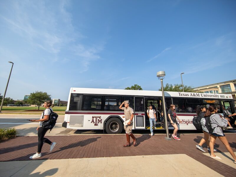 Students ride the Aggie Spirit bus