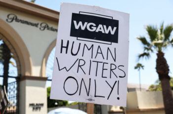 a sign used during the Hollywood writers strike in 2023. The sign reads "Human Writers Only"