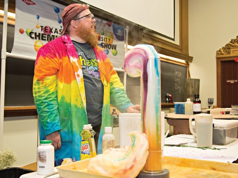 A Chemistry Road Show staff member shows off an experiment.