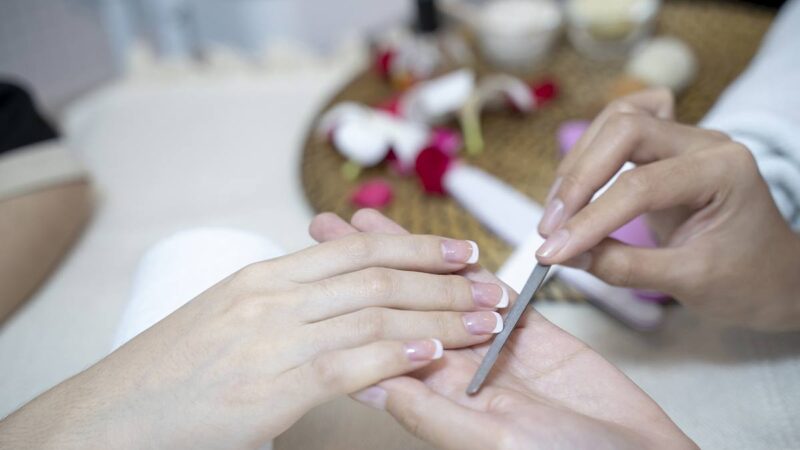 a manicure being done at a nail salon