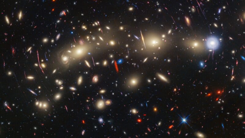 A photo of a galaxy cluster about 4.3 billion light-years from Earth.