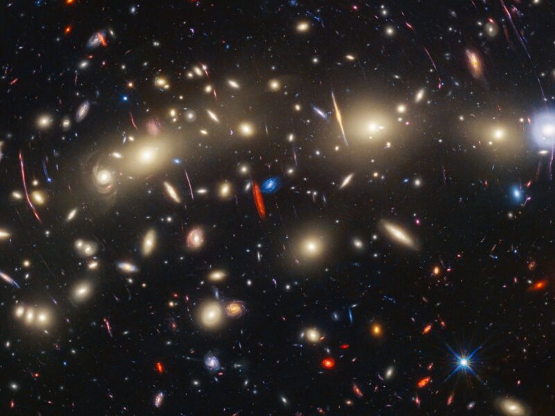 A photo of a galaxy cluster about 4.3 billion light-years from Earth.