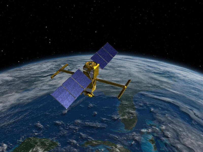 An illustration showing a satellite above the Earth's surface.