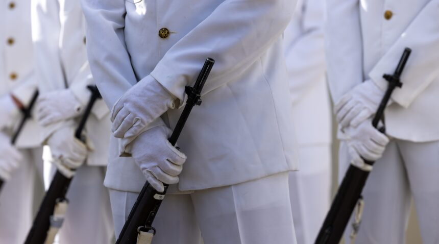 A photo of the hands of a Ross Volunteer holding a rifle.