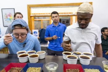 Students tasting coffee during a cupping