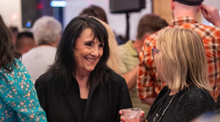 DIFF CEO Beth Wilbins chats with an attendee at the afterparty.