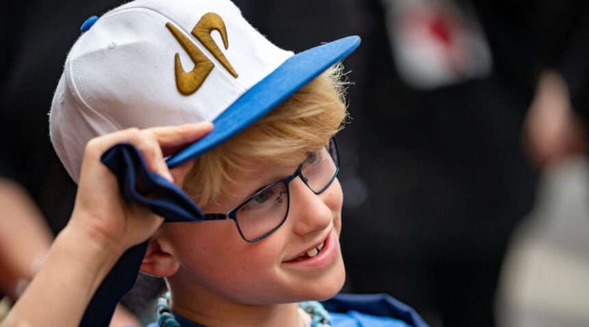 A young fan of Dude Perfect smiles outside the Majestic Theatre prior to the documentary screening.