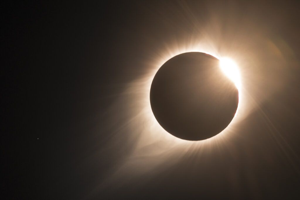 The moon passes in front of the sun in a photo of the 2017 total eclipse in North America. The sun's corona is visible.