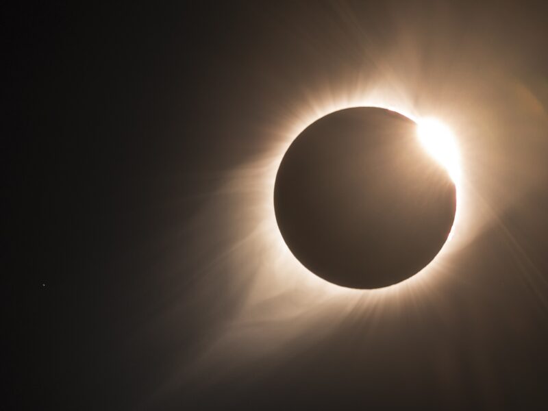 The moon passes in front of the sun in a photo of the 2017 total eclipse in North America. The sun's corona is visible.