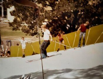 a historical photo of Mt. Aggie showing students on skis