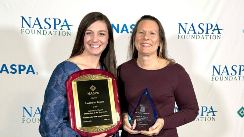 Dr. Darby Roberts and Dr. Lauren Brown posing with their NASPA awards