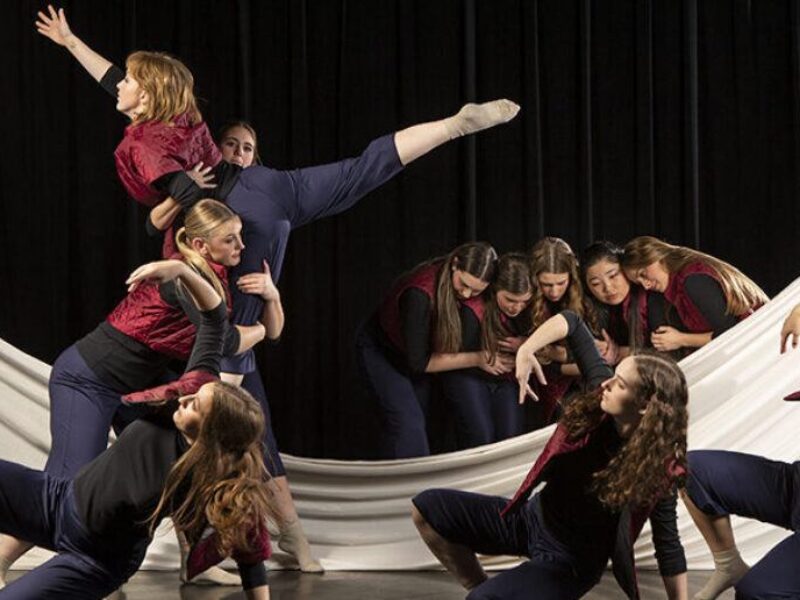 Dancers perform on stage in a rehearsal for an upcoming production from the Texas A&M University School of Performance, Visualization and Fine Arts.