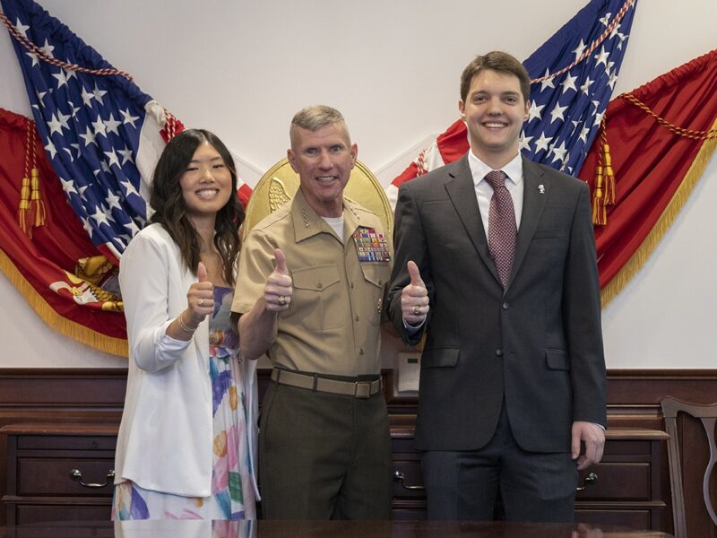 Susan Liu, Gen. Eric Smith and Lee Thornton pose for a photo