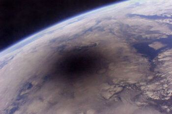 a photo of the moon's shadow on the surface of the Earth