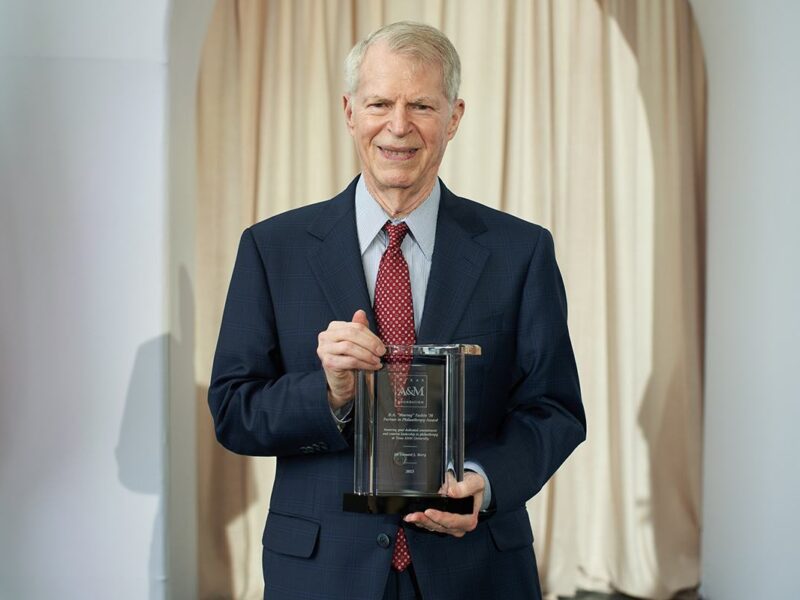 Dr. Leonard Berry holds the 2024 Texas A&M Foundation Partner In Philanthropy Award