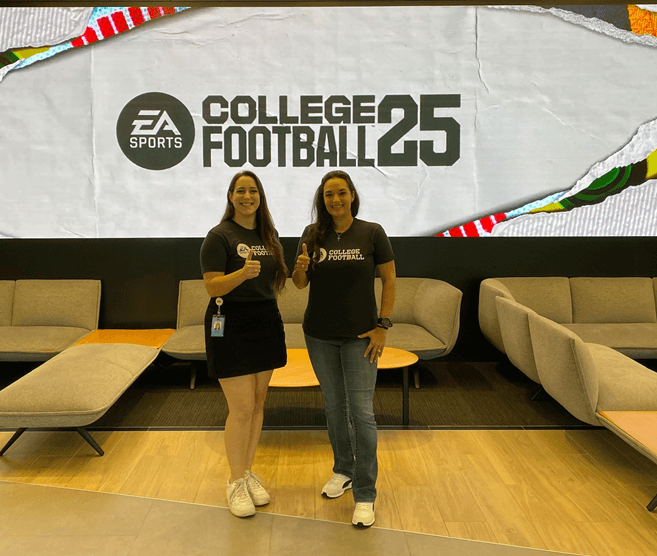 Ashley St. John, left, and Grace Arenas Strittmatter '04 pose for a photo at the EA office in Orlando in June.