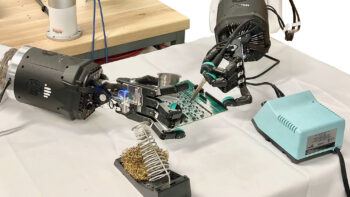 An early prototype of robotic hands soldering.