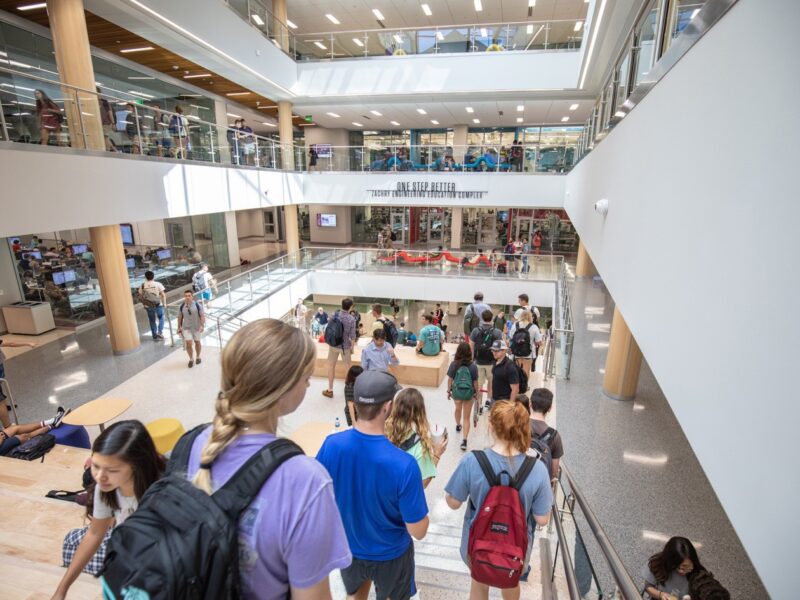 People walking in a crowded staircase