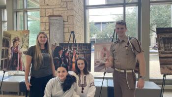 Members of the Texas A&M Ukrainian Club with tables at the MSC.