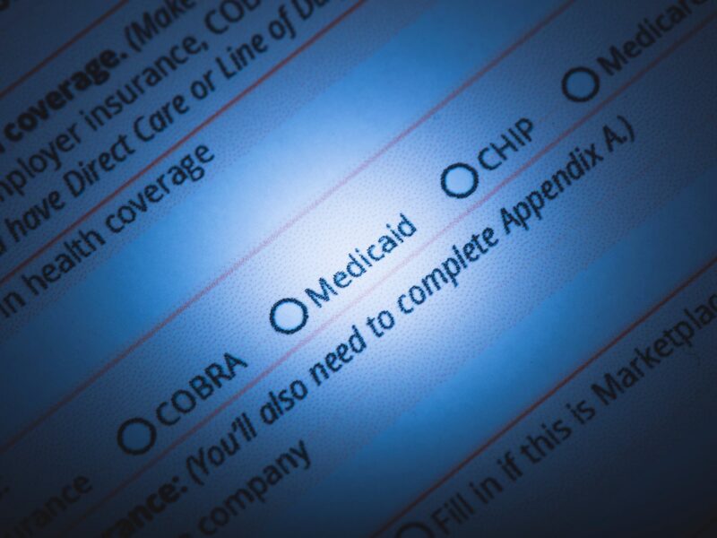 a health insurance enrollment form with a spotlight over the word Medicaid