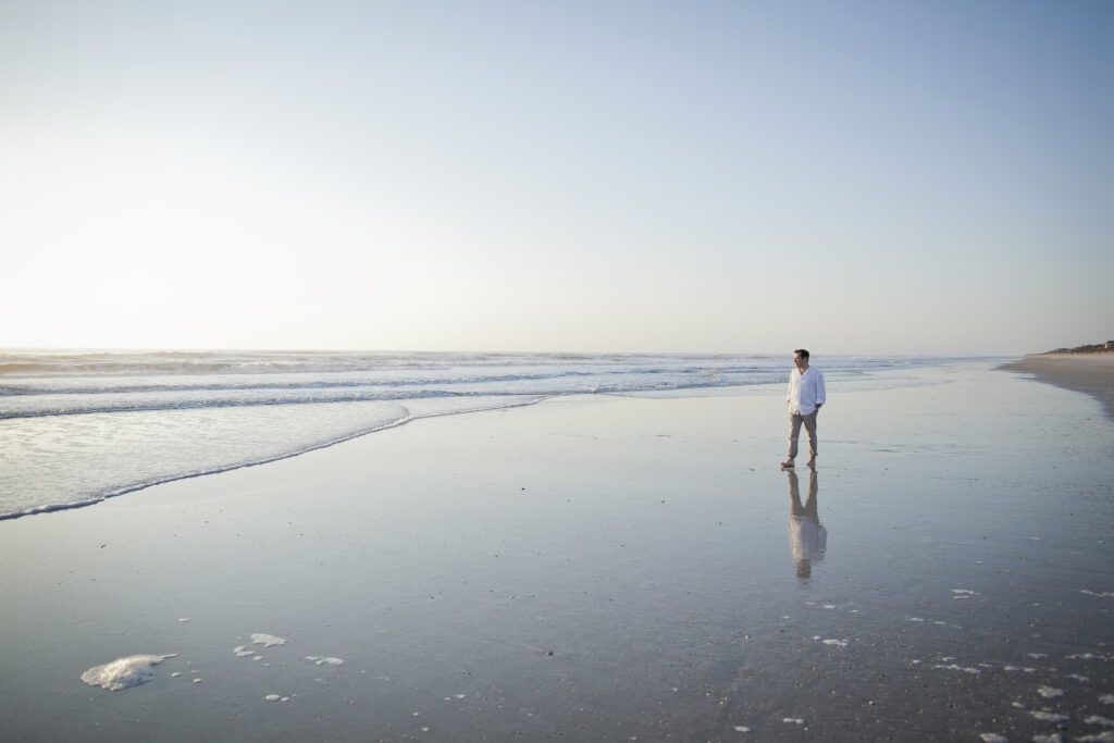 man walking on a Florida beach