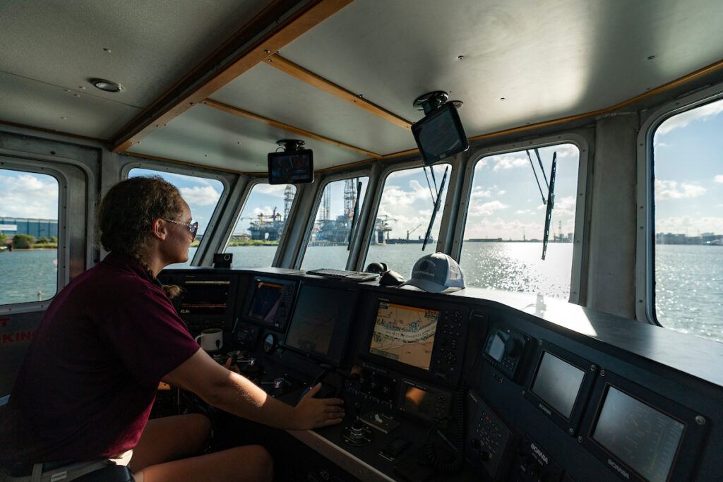 A female student driving a ship in Galveston