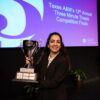 Chemical engineering doctoral student Zahra Ghiasi holds her first place trophy