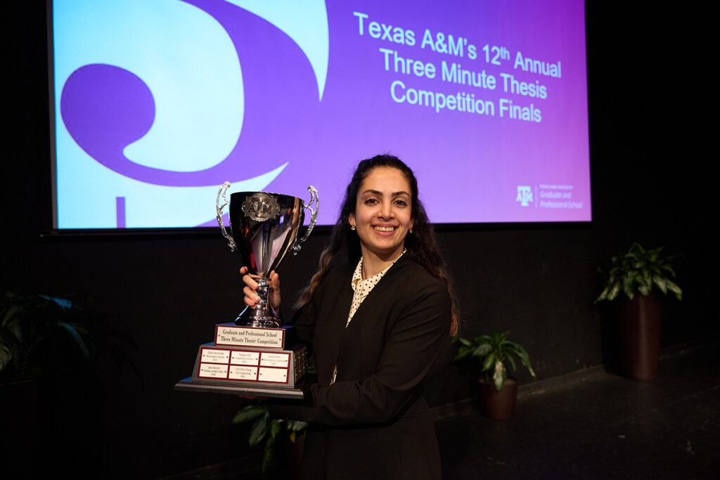 Chemical engineering doctoral student Zahra Ghiasi holds her first place trophy