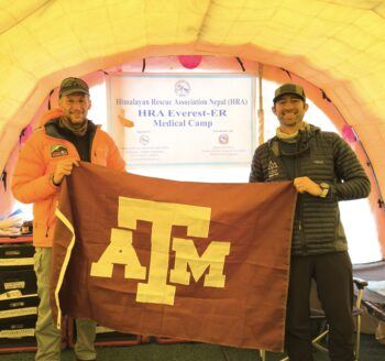 A photo of two men standing in a tent at the Mount Everest base camp.