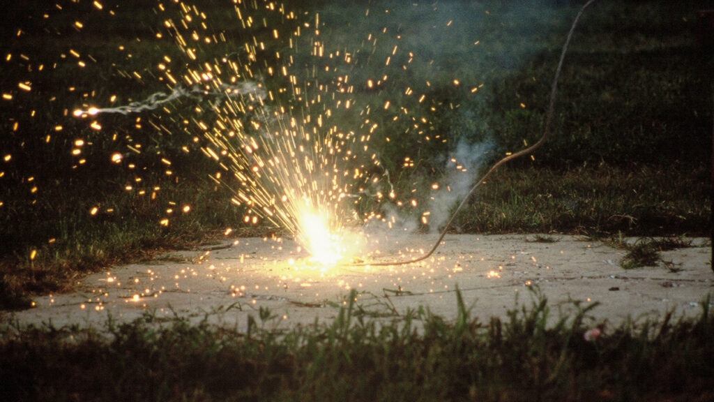 a downed conductor sparks on concrete