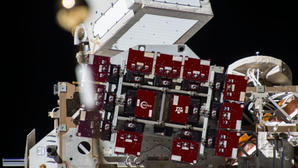 A concept graphic of the TAMU-SPIRIT attached to an EXPRESS Logistics Carrier on the exterior of the International Space Station. Individual science carriers are shown in maroon.