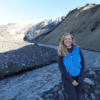 Lauren Berger stands next to a glacier in Iceland during the 2021 SAND-E Mission (Semi-Autonomous Navigation for Detrital Environments), which explored Mars-like terrain to examine how sediments change upriver versus downriver and to test rover science operations and navigation in those environments.