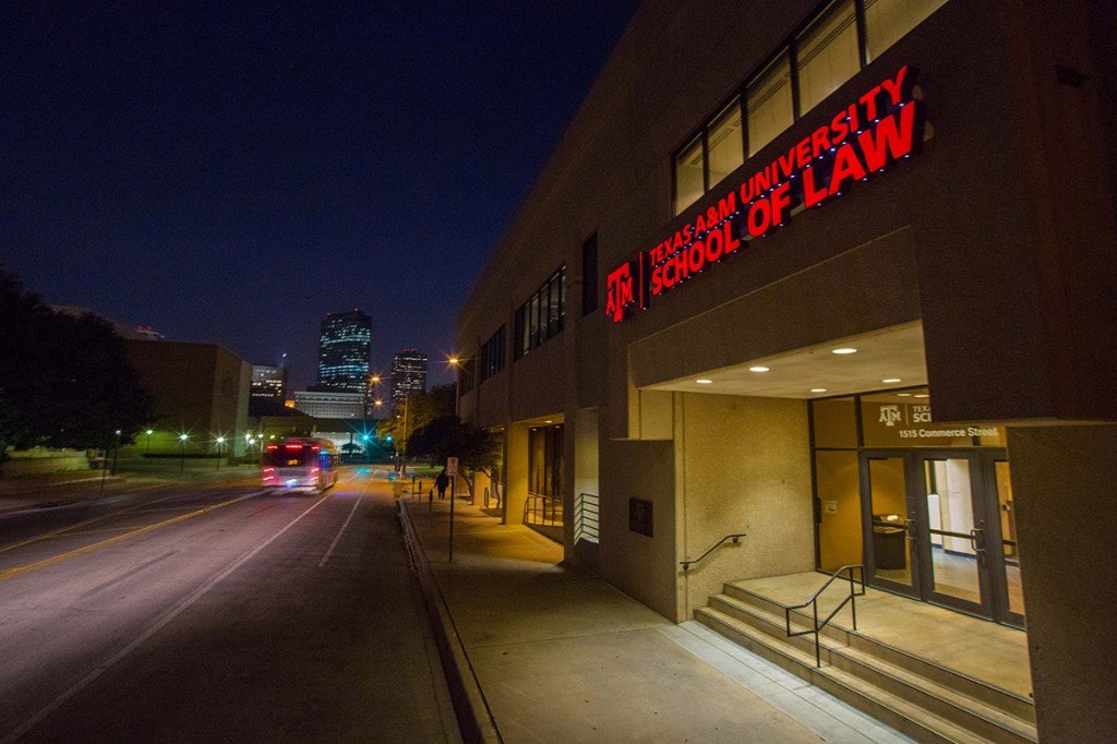 an exterior view of the law school at night