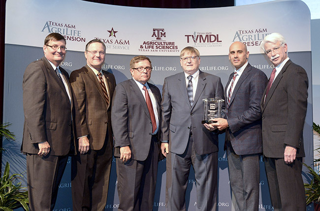 Mark Hussey, Dean and Vice Chancellor of the College of Agriculture and Life Sciences; Van Taylor, Texas A&M Foundation Trustee; Otway Denny, Texas A&M Foundation Trustee; M. Edward Rister, recipient of Partner in Philanthropy Faculty Award; Tyson Voelkel, President of the Texas A&M Foundation; and Jorge Bermúdez, Texas A&M Foundation Trustee.