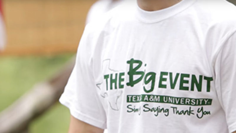 Person wearing white Big Event shirt