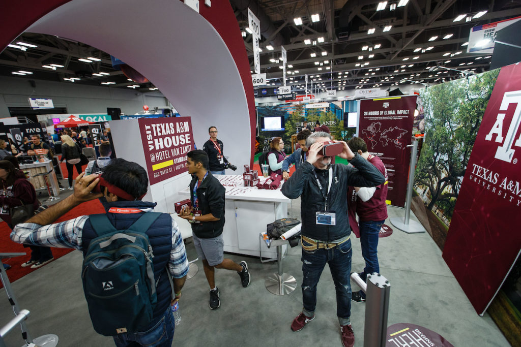 Exhibitors at the SXSW Trade Show take a virtual tour of Texas A&M's global impact. 