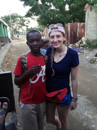 Avery Young (right) interacted with children regularly while in Haiti.