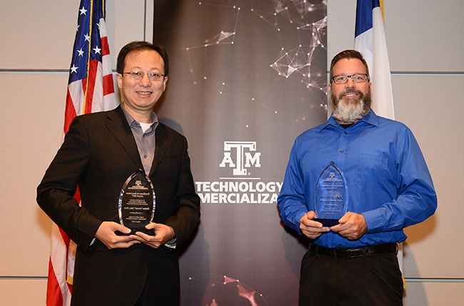 Dr. Joshua Yuan (left) and Dr. Greg Sword (right) received an Innovation Award from Texas A&M Technology Commercialization (TTC) during an awards luncheon Thursday.