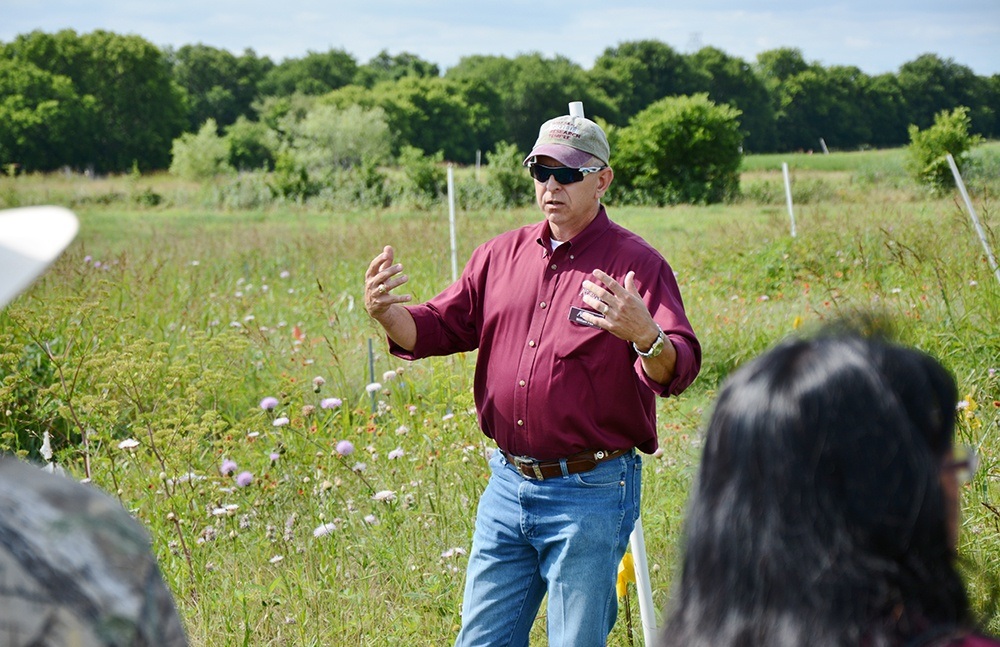 Dr. Bill Fox, AgriLife Research rangeland ecologist, Temple, talks to a group about native prairies and a growing trend of producers returning improved pastures to native grasses and forages.