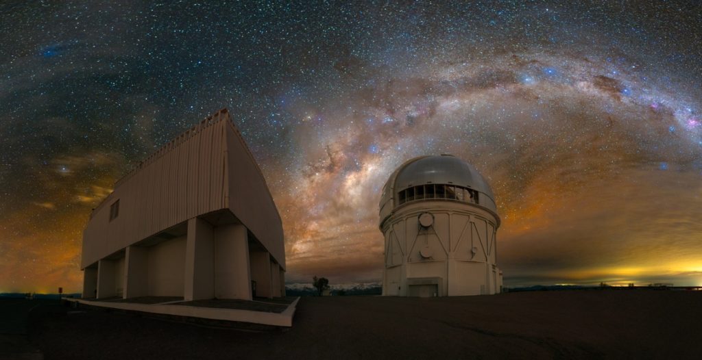 The Milky Way as seen over the Cerro Tololo Inter-American Observatory in Chile and the 4-meter Victor M. Blanco Telescope, home to the 570-megapixel Dark Energy Camera and some of history's first images of a binary neutron star merger, taken by Texas A&M University astronomer Jennifer Marshall.