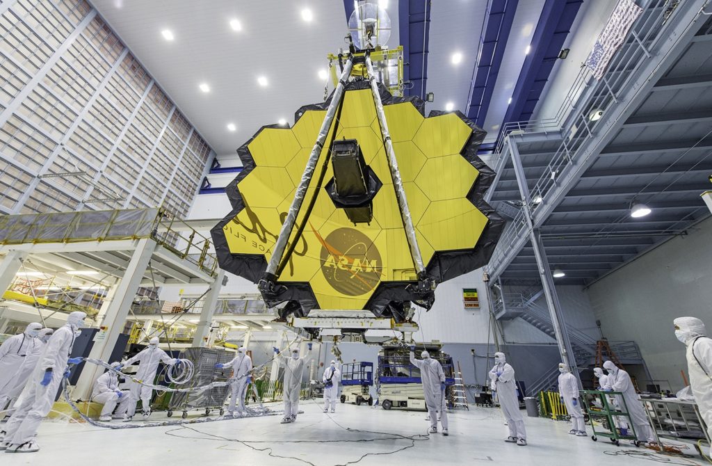 Once launched into space, the Webb telescope's 18-segmented gold mirror is specially designed to capture infrared light from the first galaxies that formed in the early universe and will help the telescope peer inside dust clouds where stars and planetary systems are forming today. (NASA/Desiree Stover)