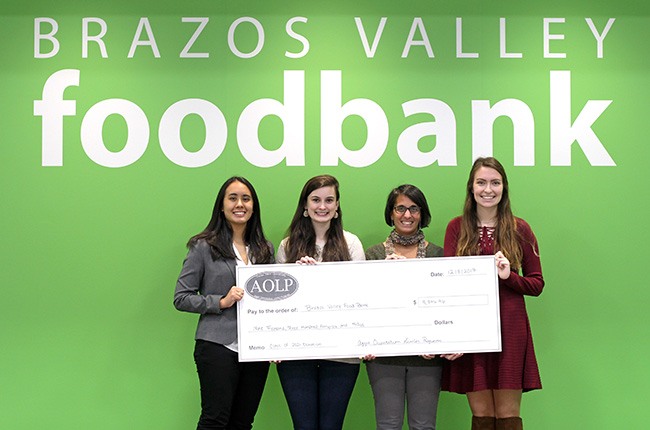 (L to R): Amanda Coronado ’18, Lauren Goza ’20, Theresa Mangapora, Executive Director, Brazos Valley Food Bank, and Mia Carrola ’19.