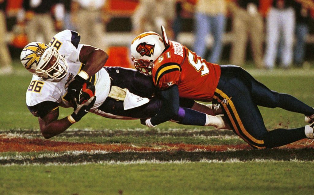 24 Feb 2001: Ed Smith #86 of the Birmingham Bolts is pulled down by Orlando Rage linebacker James Burgess #51 following a first half reception during a first half reception in the Bolts v Rage game at the Florida Citrus Bowl in Orlando, Florida. Mandatory Credit: Chris Livingston/ALLSPORT