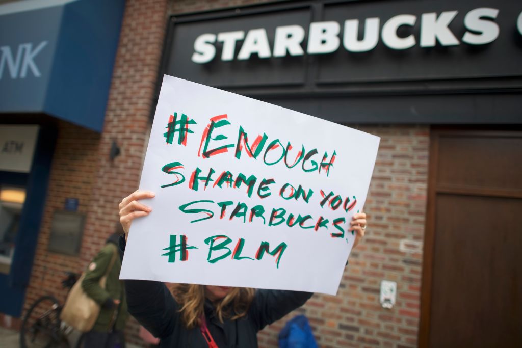 Protesters demonstrate outside a Starbucks on April 15, 2018 in Philadelphia, Pennsylvania. Police arrested two black men who were waiting inside the Center City Starbucks which prompted an apology from the company's CEO. (Mark Makela/Getty Images)