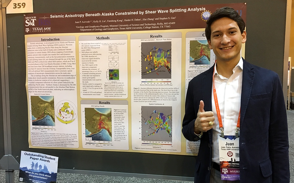 Acevedo with his research poster at AGU 2017.