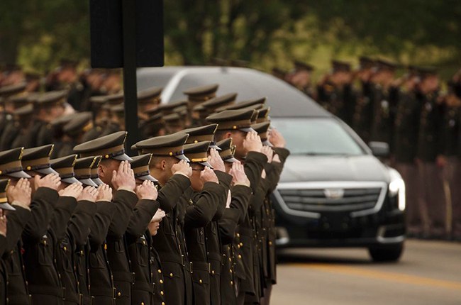 The hearse carrying former first lady Barbara Bush passes through members of the Texas A&M Corps of Cadets as it nears her husband's presidential library at the university on April 21. 700 members of the Corps of Cadets lined the Barbara Bush Drive leading up to the library. (Smiley N. Pool-Pool/Getty Images)