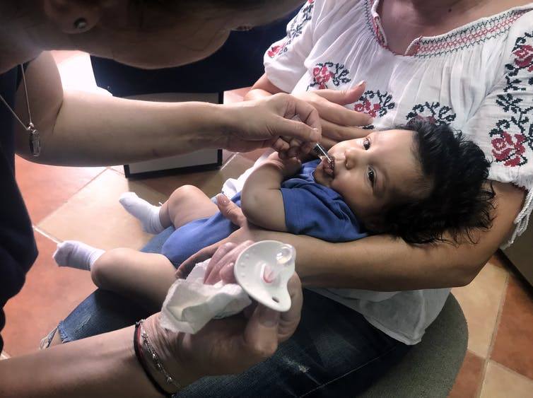 A child in Romania, on June 6, 2018, receives vaccination after a measles outbreak has sickened hundreds of children. Health officials say the outbreak is serious because of low vaccination rates.  (Olimpiu Gheorghiu/AP Photos)